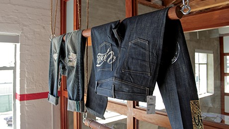 Denim jeans hanging in one of our customer design and innovation center