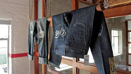 Denim jeans hanging in one of our customer design and innovation center